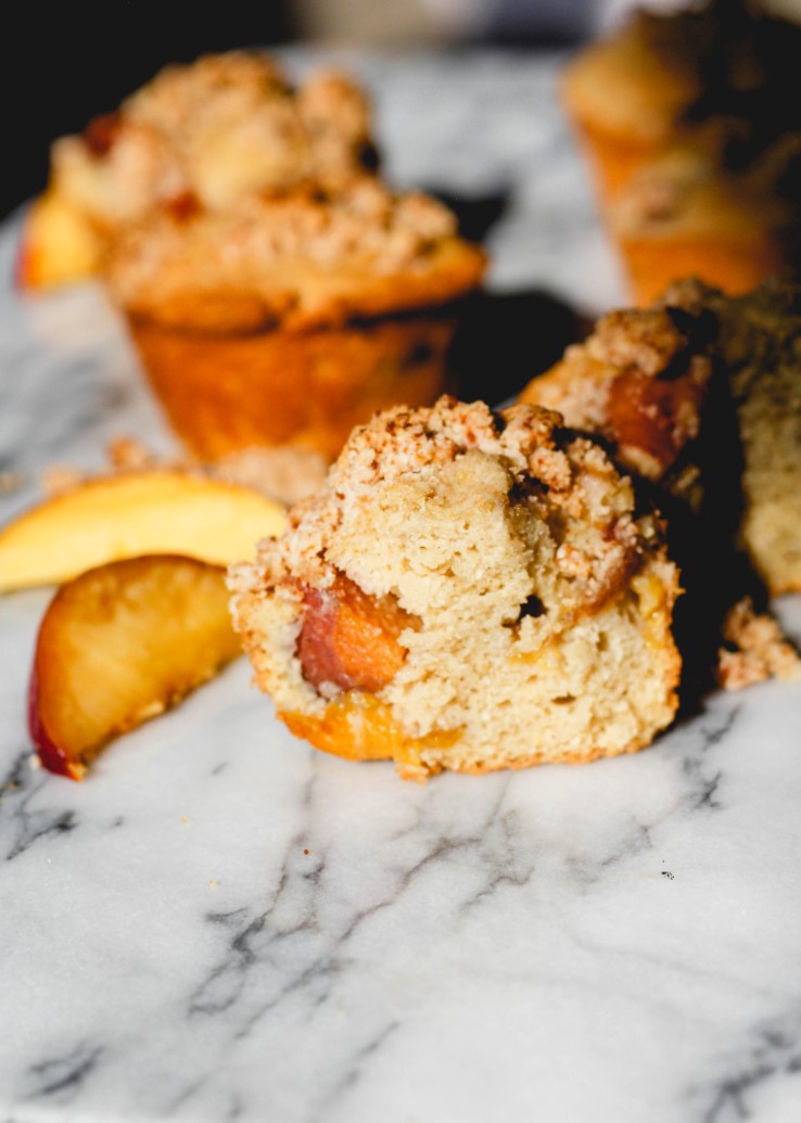 image of peach muffin on a marble counter