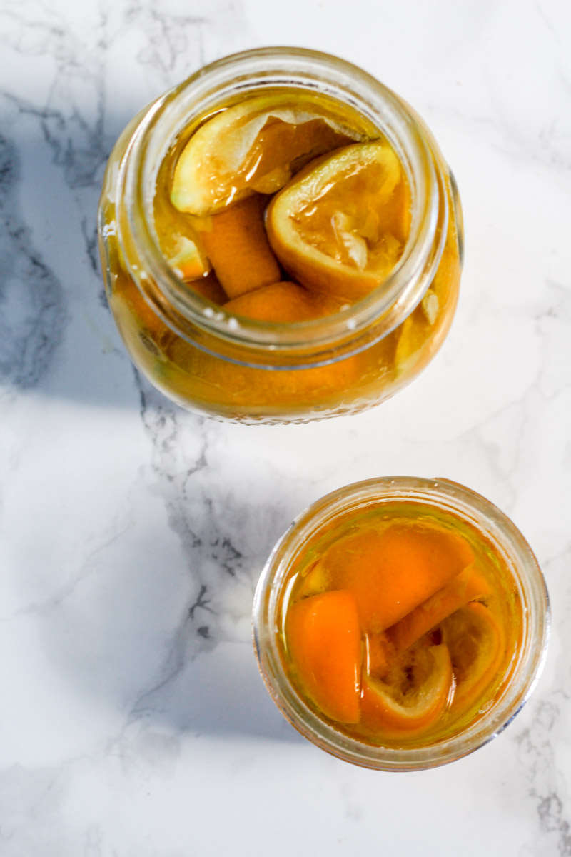 overhead image of preserved Meyer lemons in jars