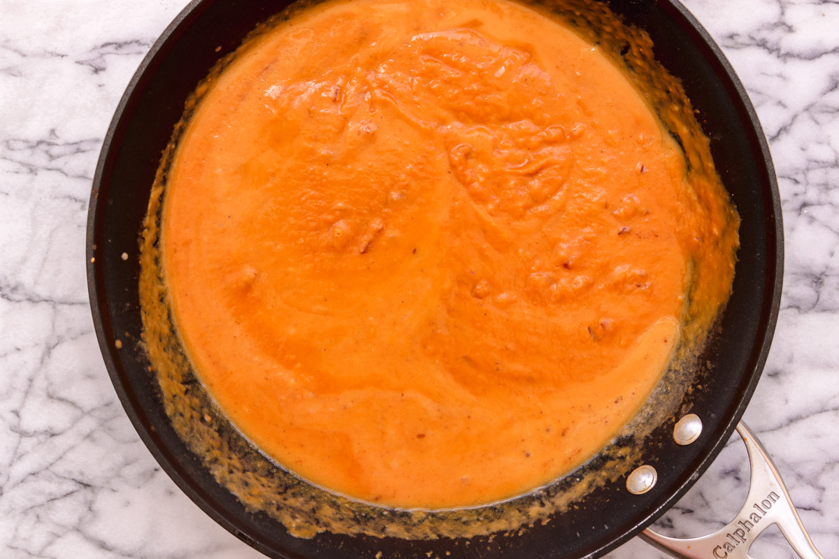 overhead image of a pumpkin sauce in a skillet