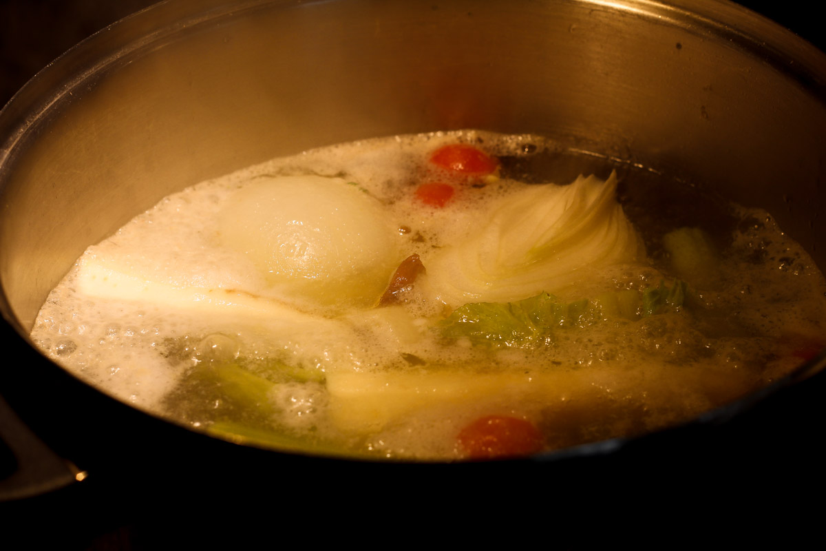overhead image of soup simmering in pot