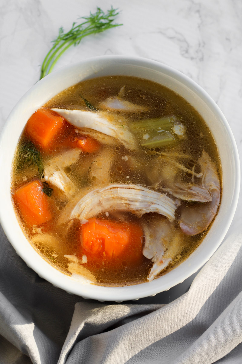 overhead image of bowl of slow cooker whole chicken soup