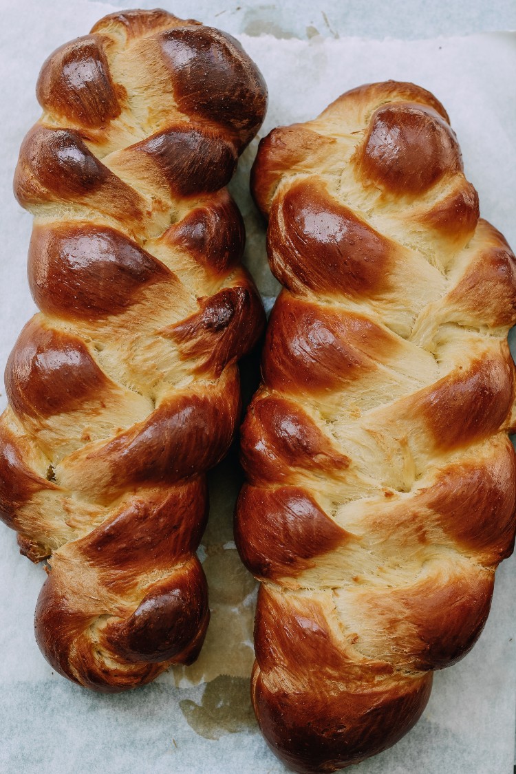 overhead image of braided loaves on baking sheet