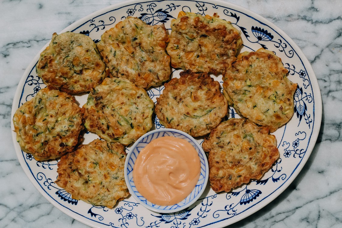 overhead image of fritters on a plate.