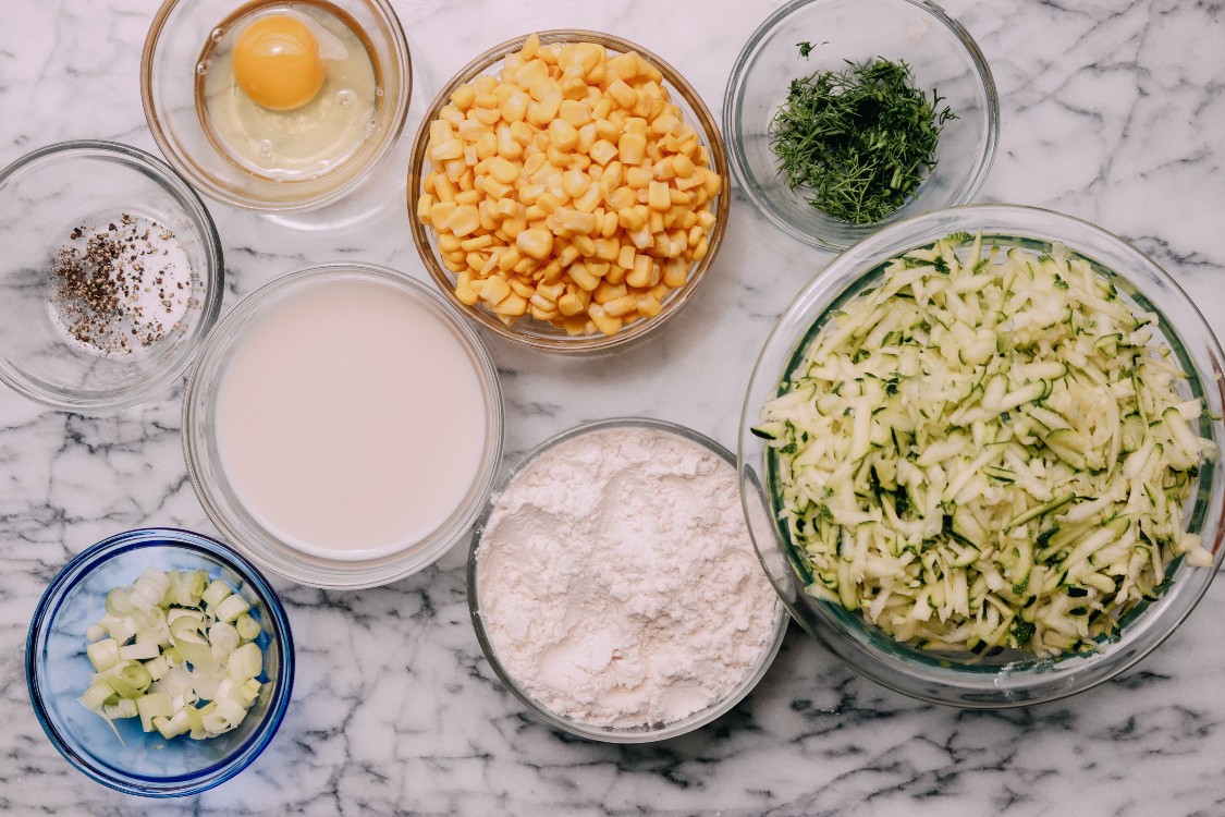 image of making zucchini and corn fritters.