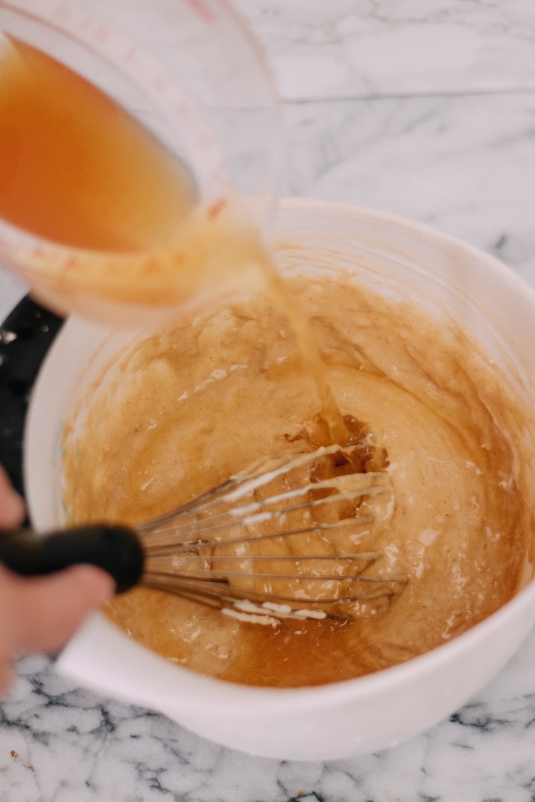 image of making apple cider loaf cake in mixing bowl