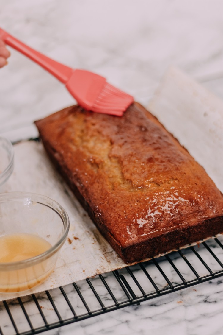 image of brushing butter on a loaf cake