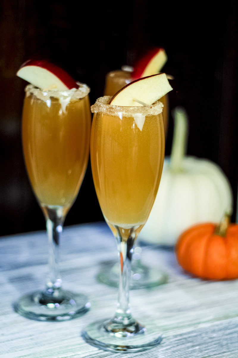 image of apple cider mimomas with pumpkins in background