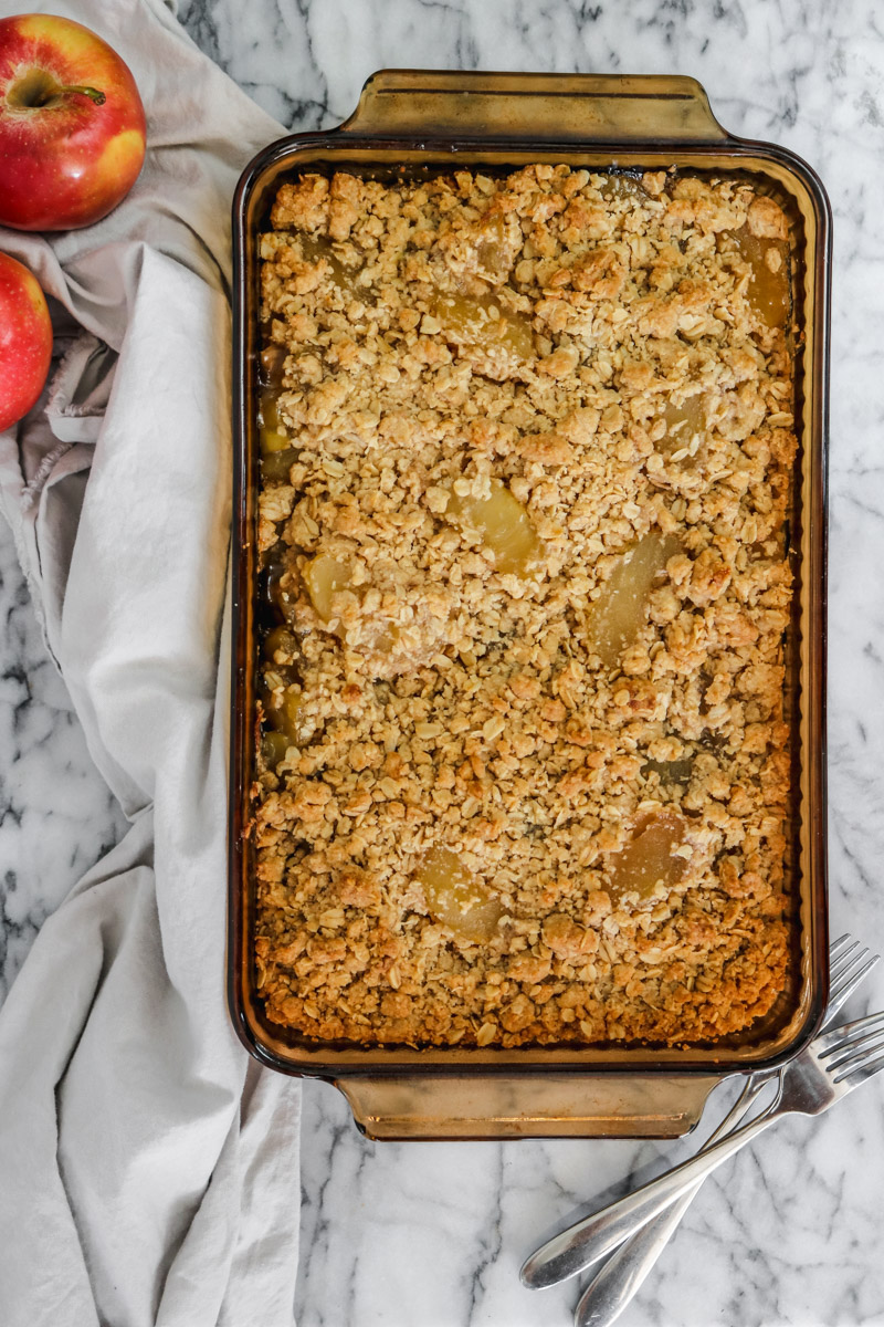 overhead image of easy apple crisp with oats topping in a baking casserole.