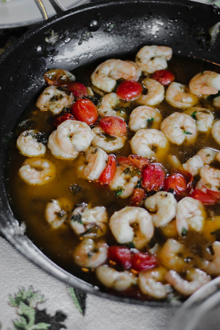 overhead image of shrimp and tomato sauce in a skillet