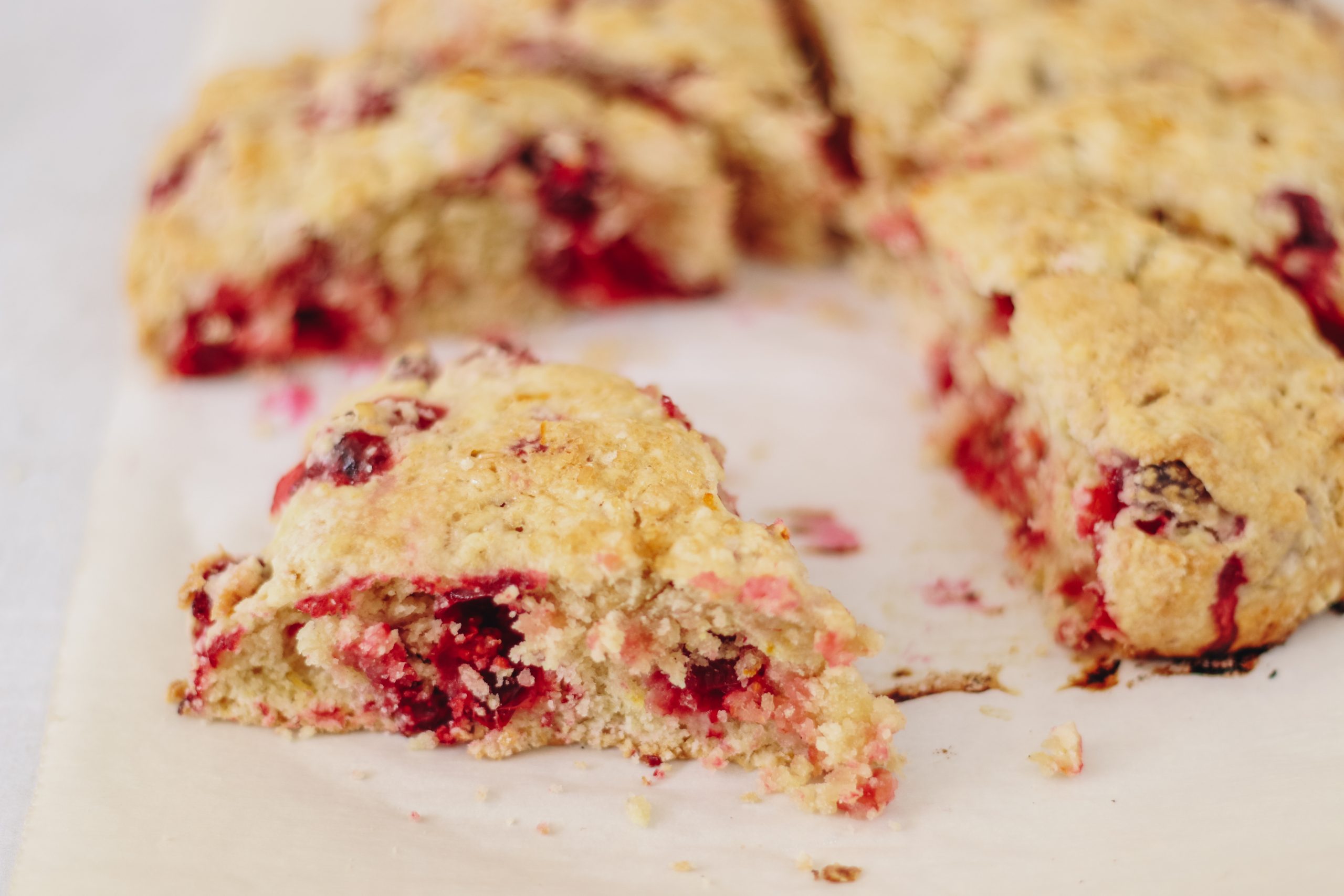 Vegan Clementine Cranberry Scones are flaky and delicious. These delightful scones are bursting with clementine flavor and juicy tart cranberries. Completely dairy free and so easy to make!