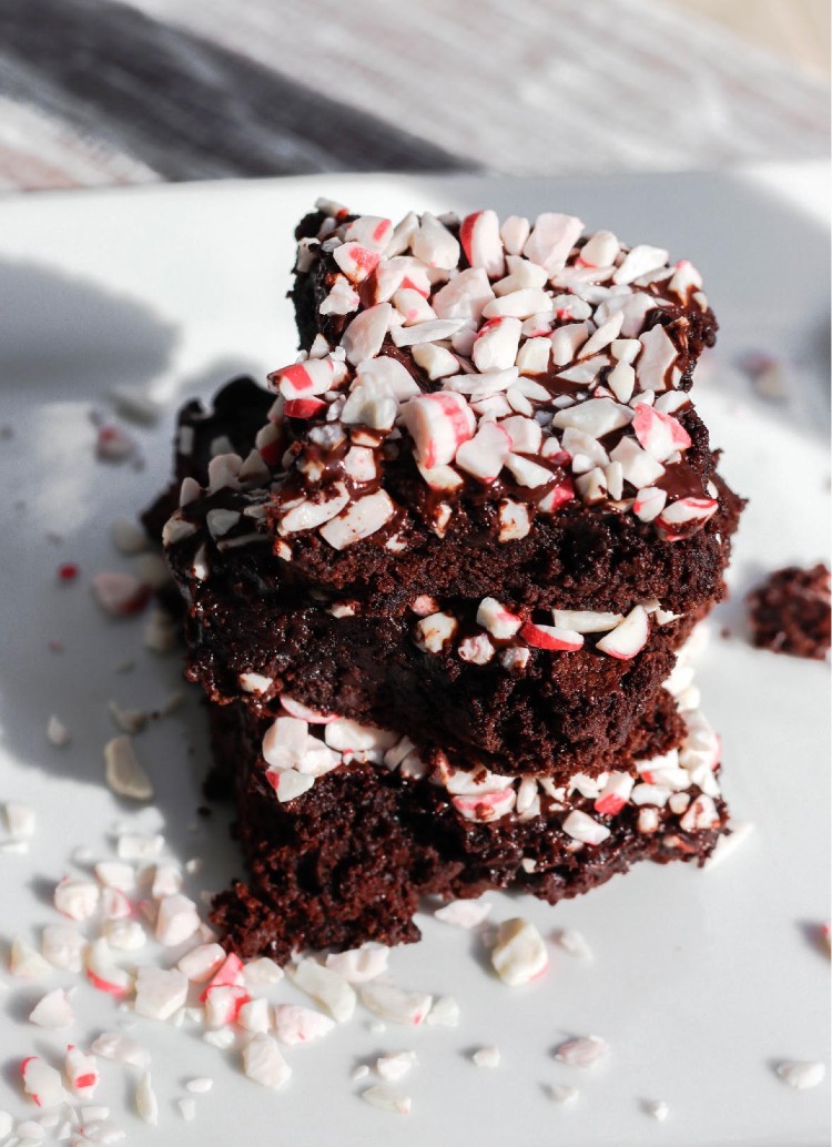 overhead image of easy peppermint brownies stacked on a white dish