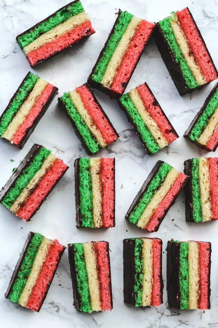 overhead image of Italian rainbow cookies on a marble background