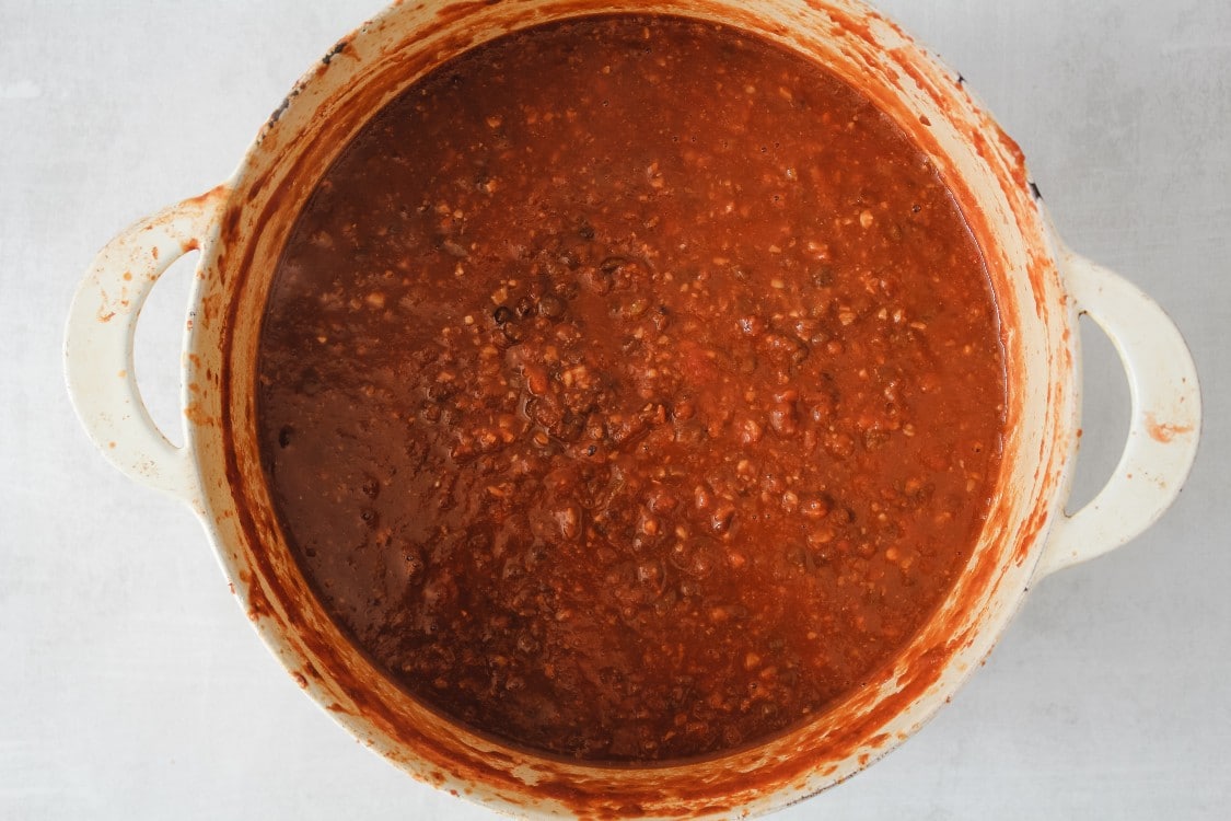overhead image of tomato sauce in a large pot