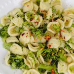closeup image of orecchiette pasta with broccoli sauce