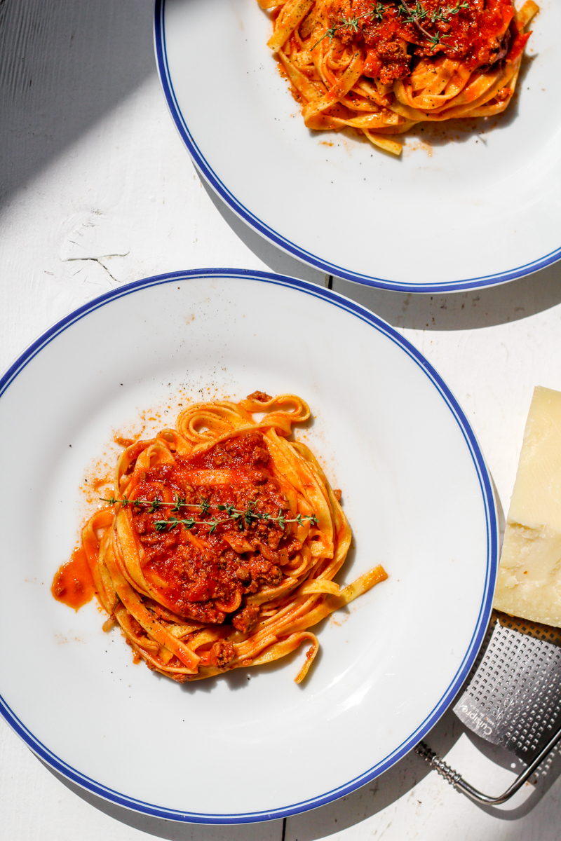 overhead image of fettuccine with weeknight lamb ragu' on a white plate