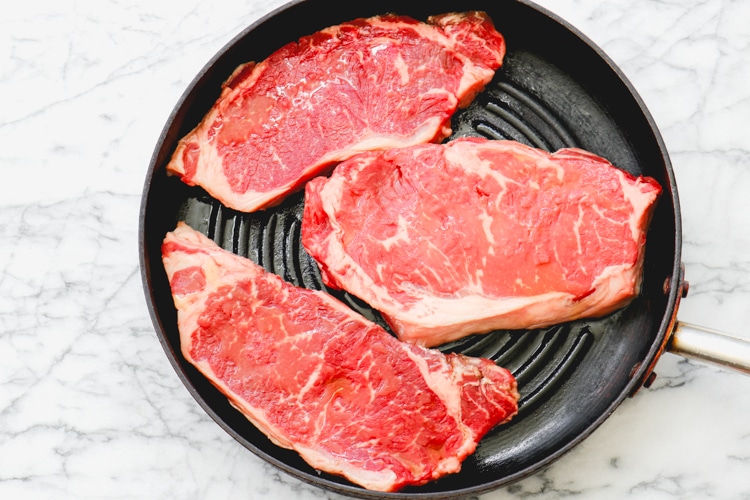 image of steak on a grill pan