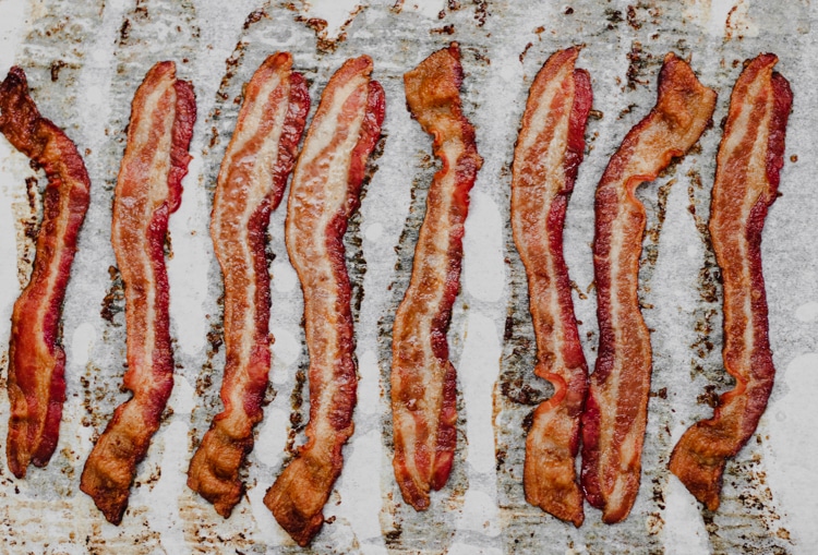 oven baked bacon on a baking sheet