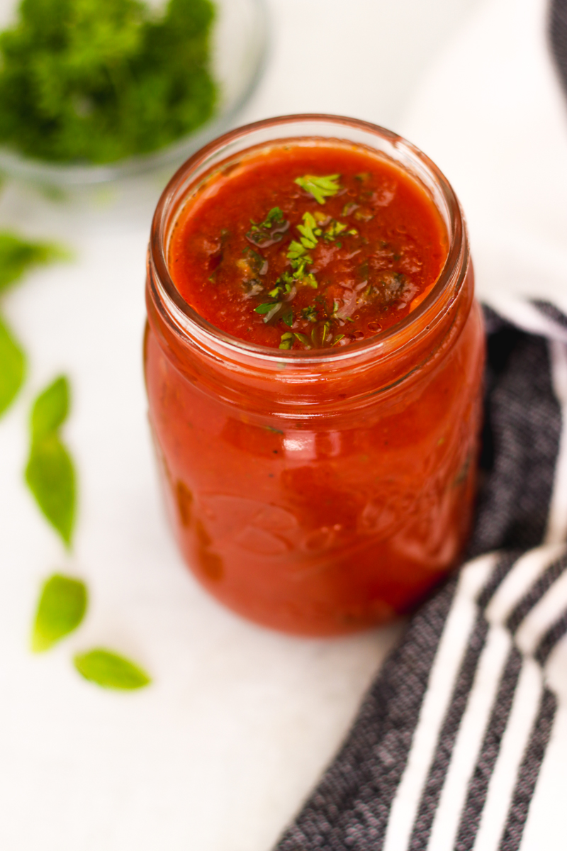 overhead image of a red sauce in a jar