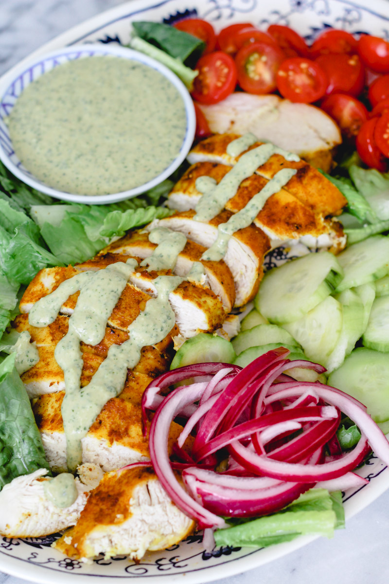 close-up image of a chicken salad on a plate. 