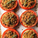Pomodori gratinati fresh from the oven, cut tomatoes glistening with olive oil and golden breadcrumb crust