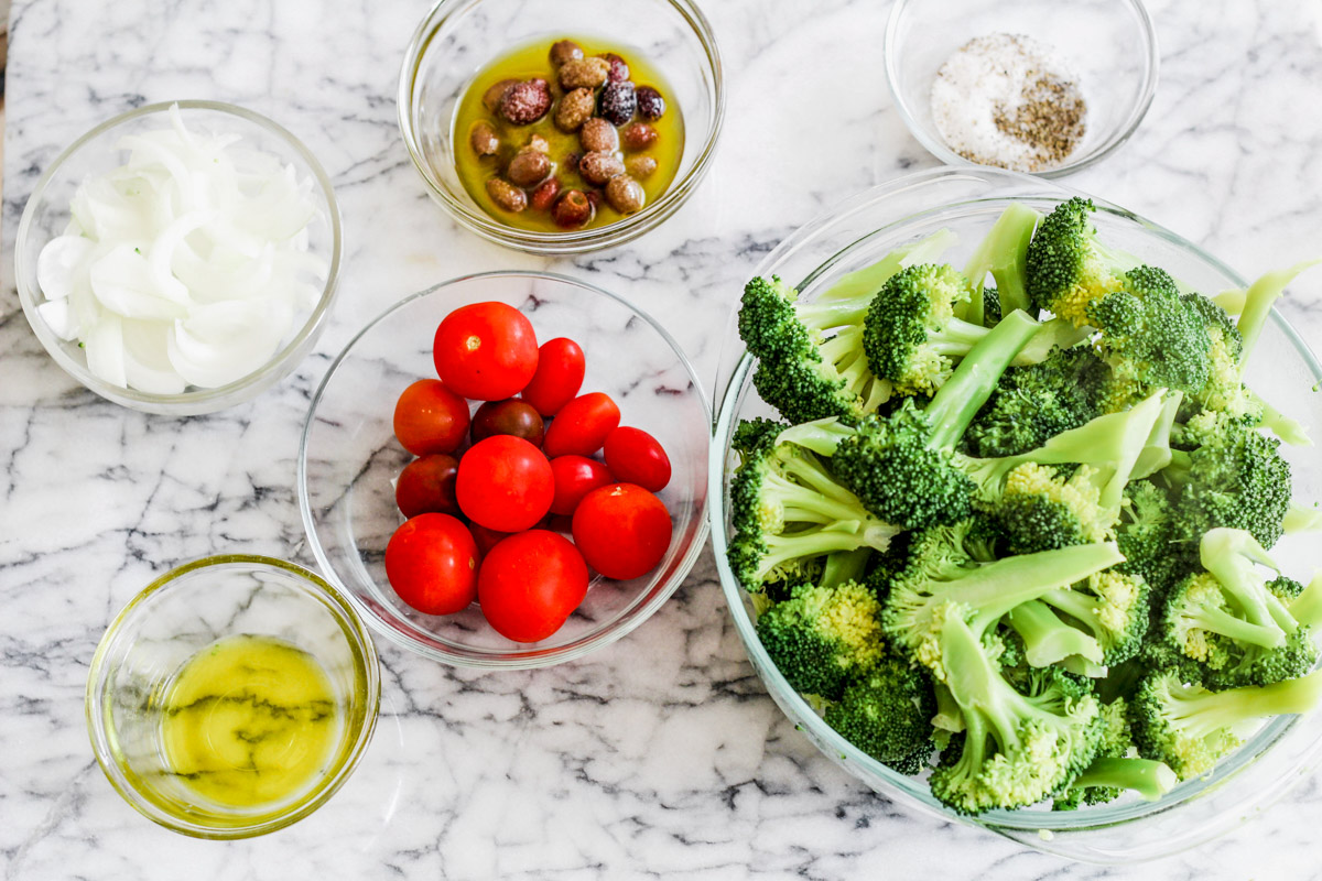 image of ingredients to make a broccoli scacciata on a marble background