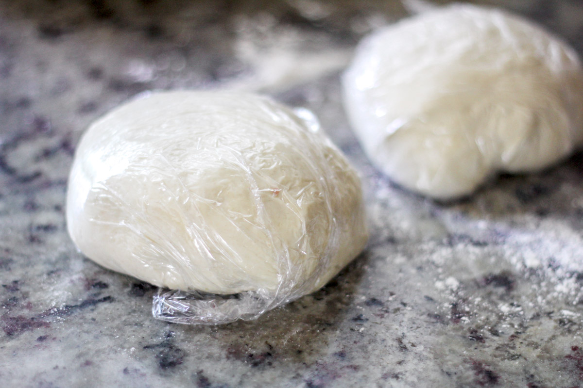 image of Homemade Sardinian Culurgiones dough wrapped in plastic wrap