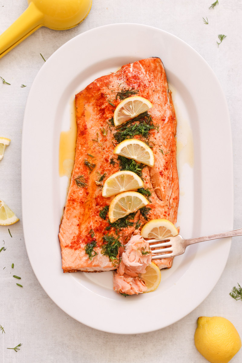 overhead image of easy baked salmon with lemon slices