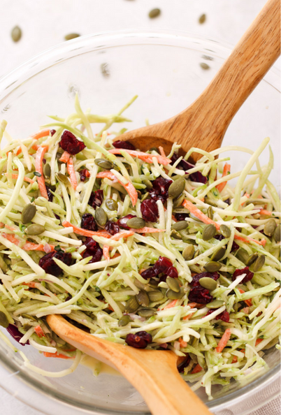 broccoli slaw closeup image with spoons