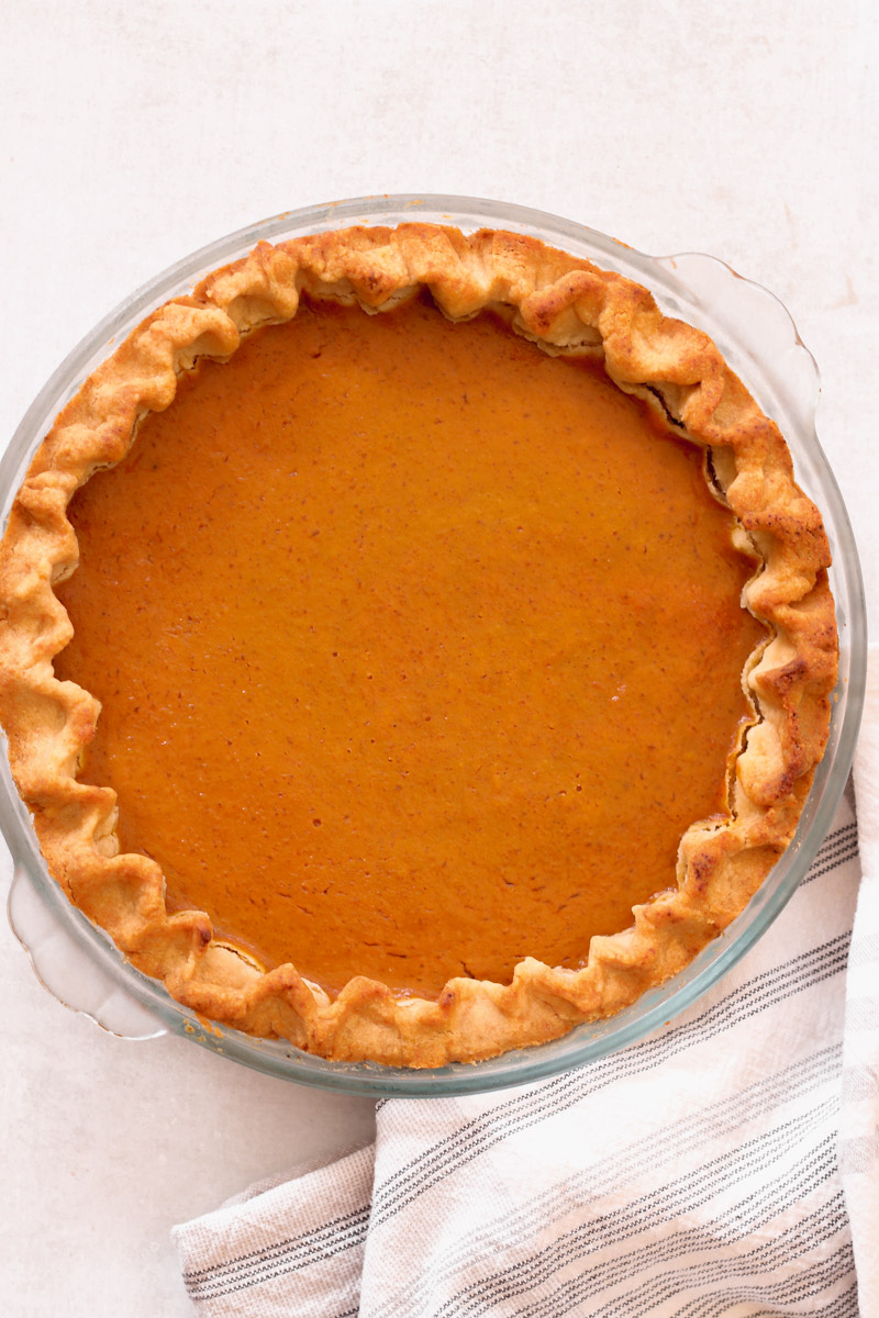 overhead image of easy homemade pumpkin pie in a pie plate.