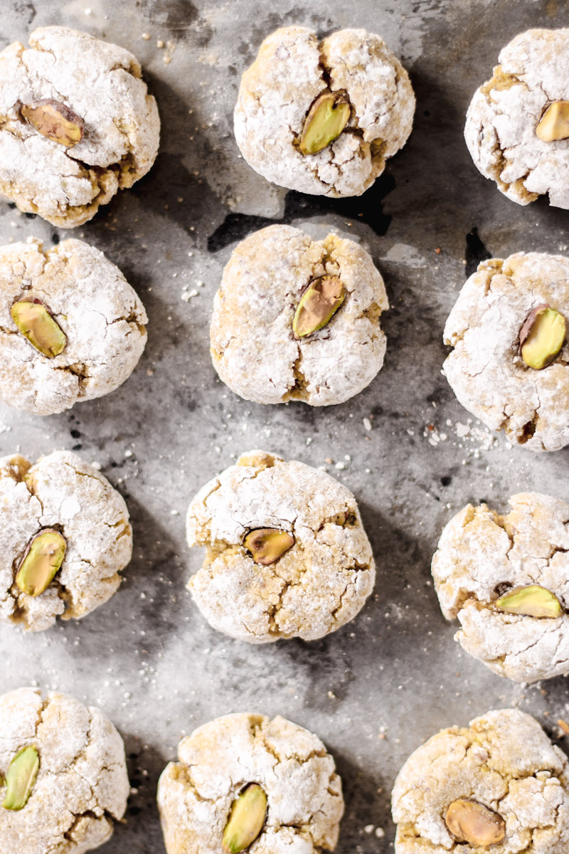 overhead image of pistachio cookies on a baking sheet