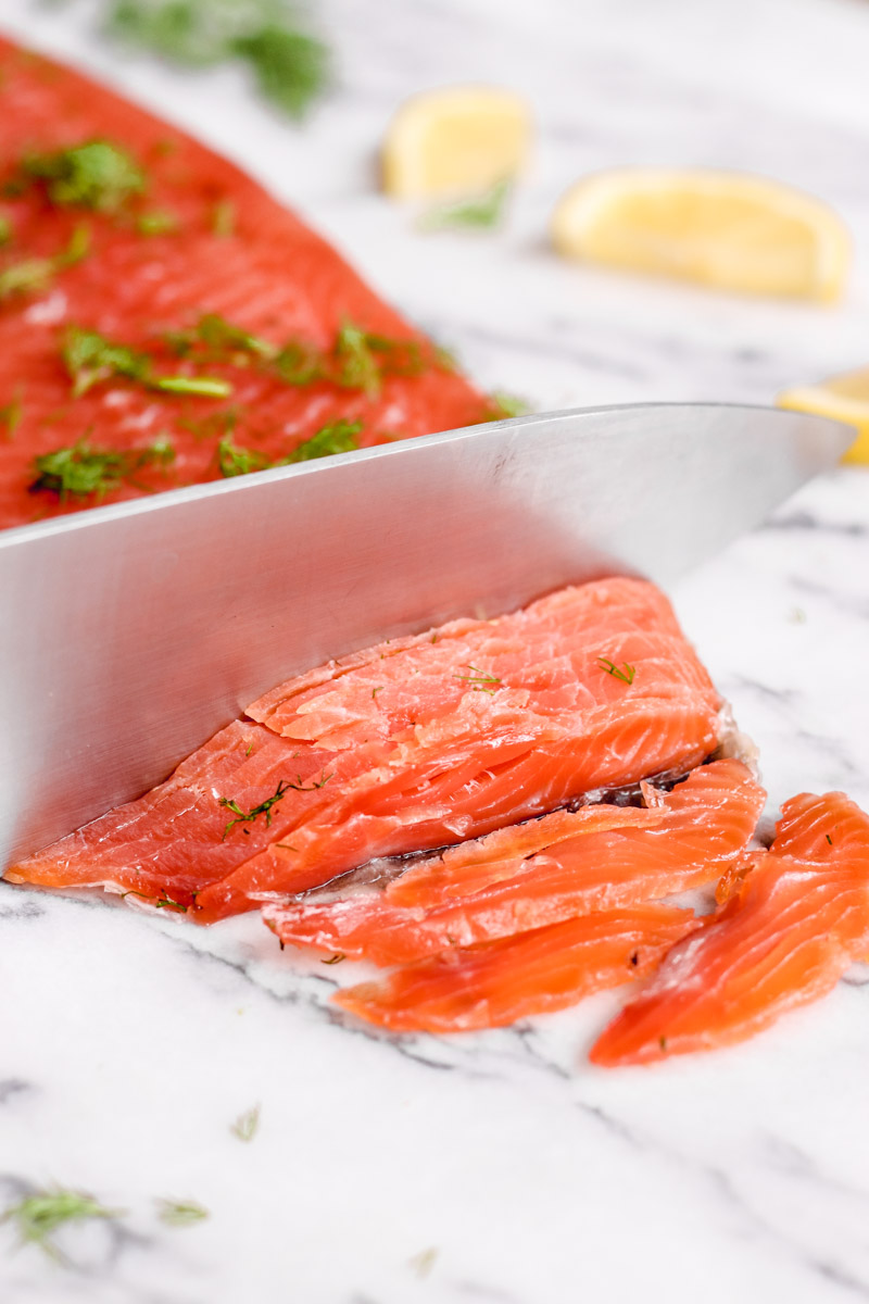 image of knife slicing salmon