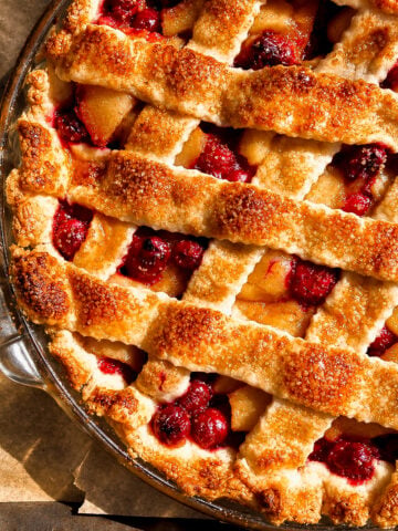 Cranberry apple pie with a golden lattice crust and sparkling sugar