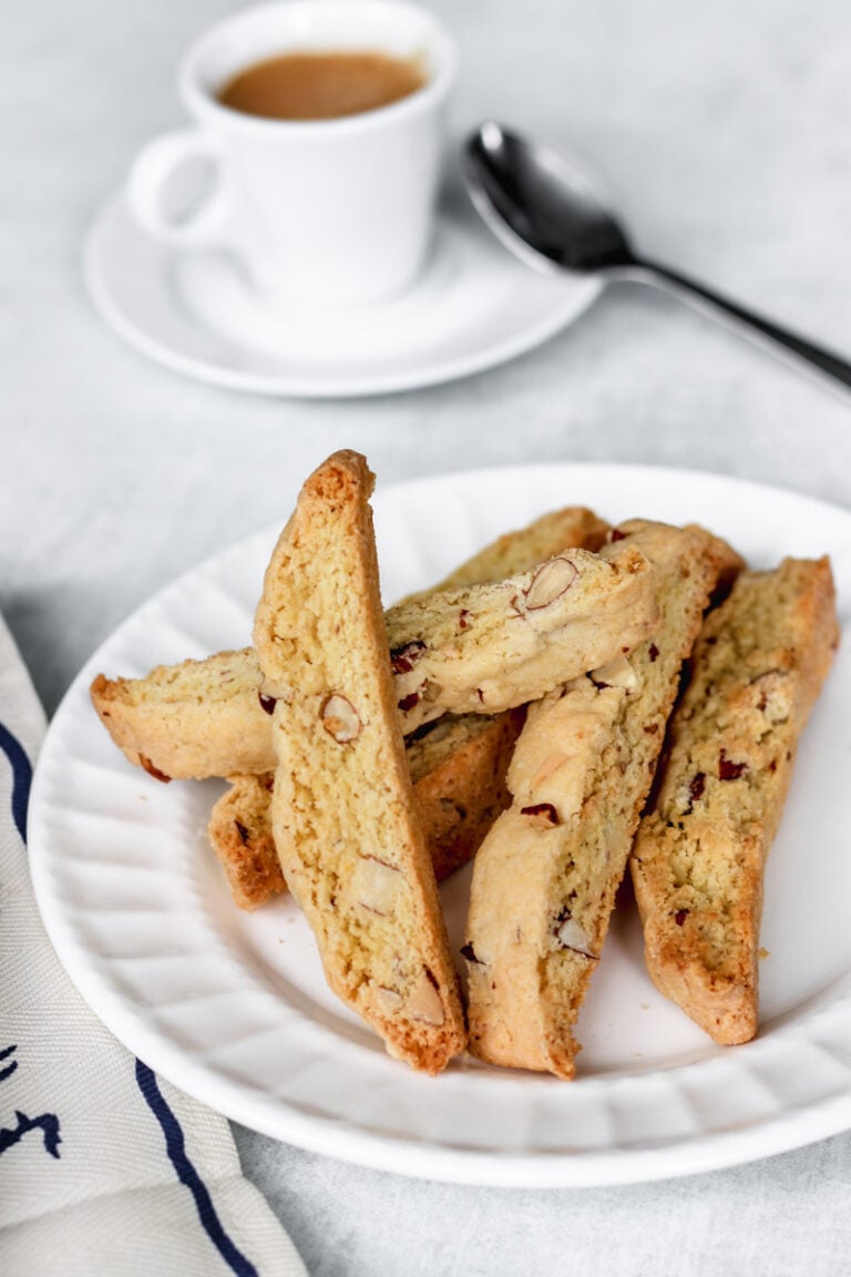 almond biscotti with espresso in the background.