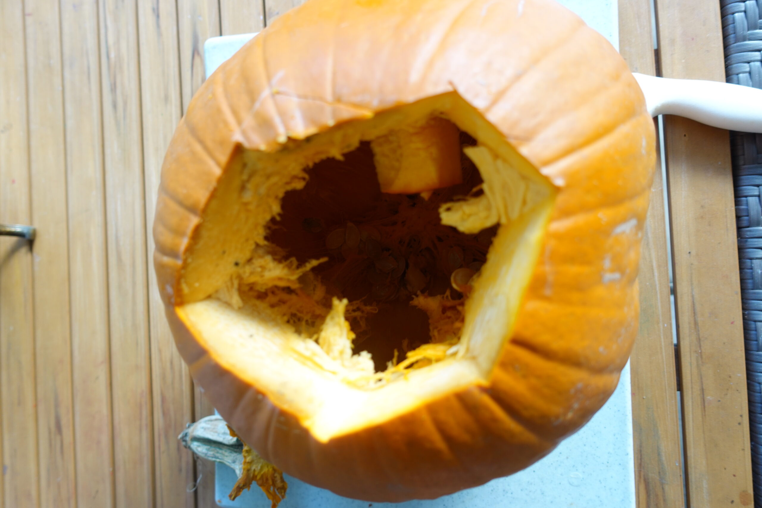 image of cut open pumpkin on a table. 