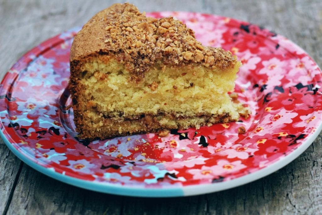 image of coffee cake slice on a pink plate.