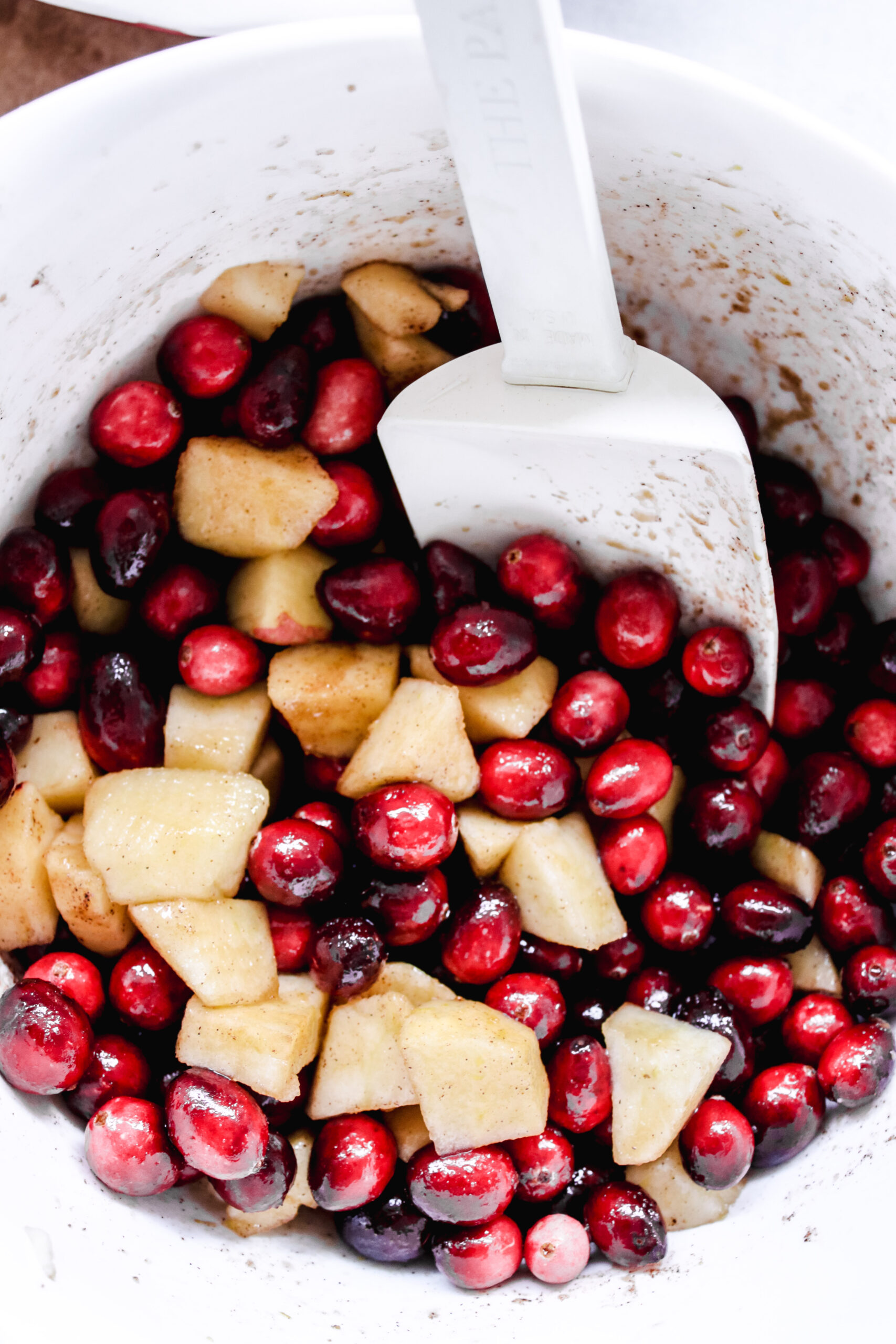 cranberry and apples in a bowl.