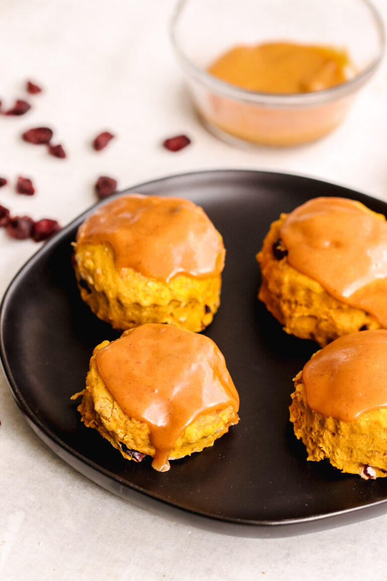 pumpkin scones on a black dish.
