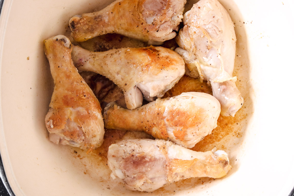 image of cooking chicken in a pot. 