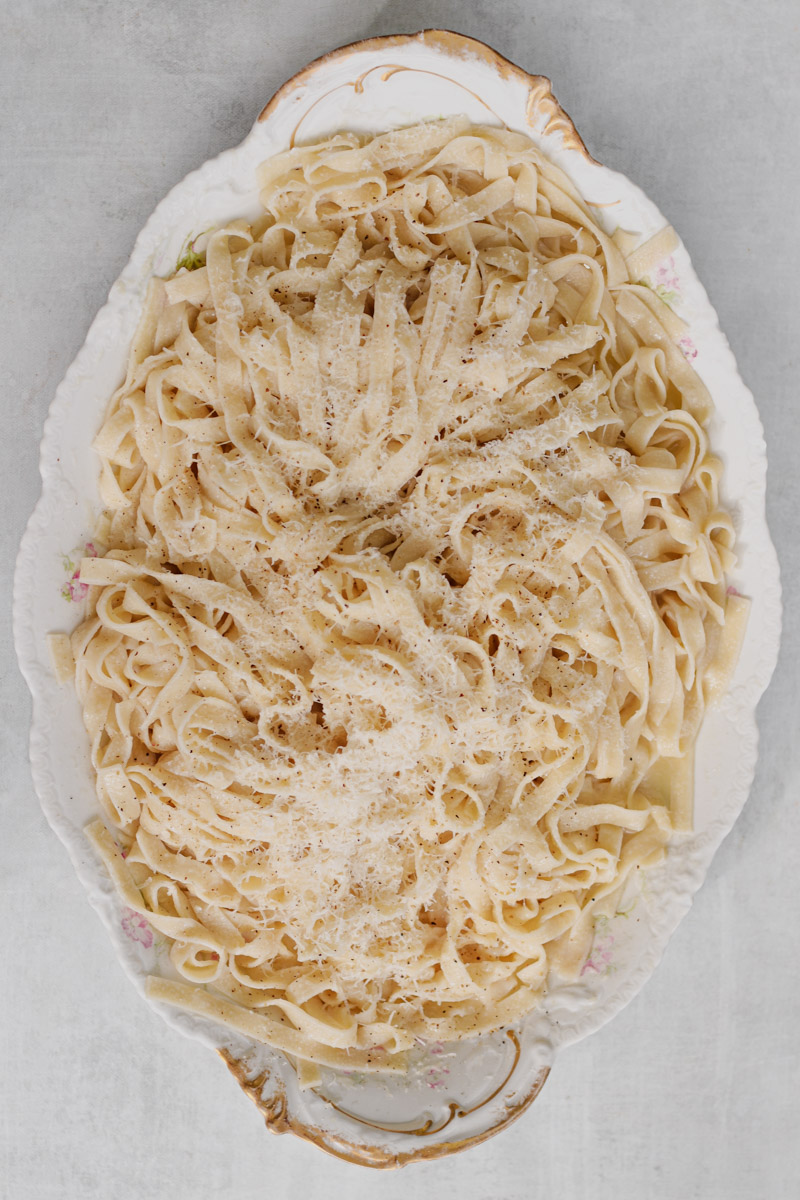 overhead image of authentic Fettuccine Alfredo pasta on a serving platter.