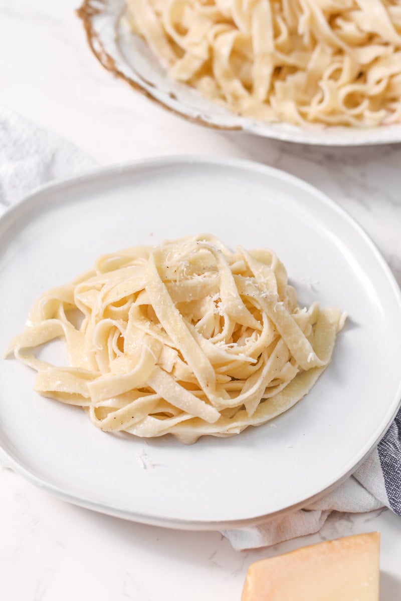 image of fettuccine alfredo finished in white platter.