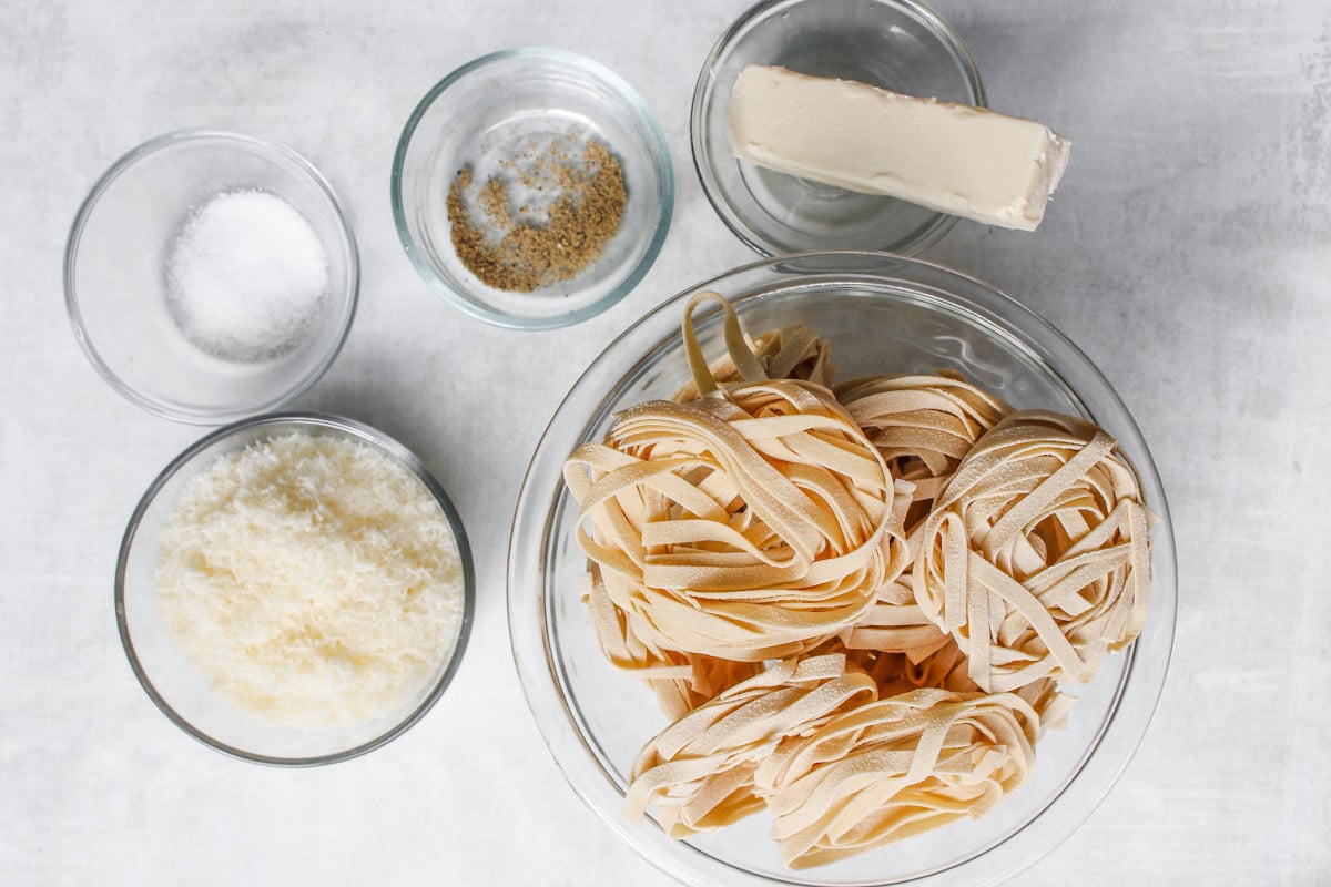 overhead image of fettuccine Alfredo ingredients.