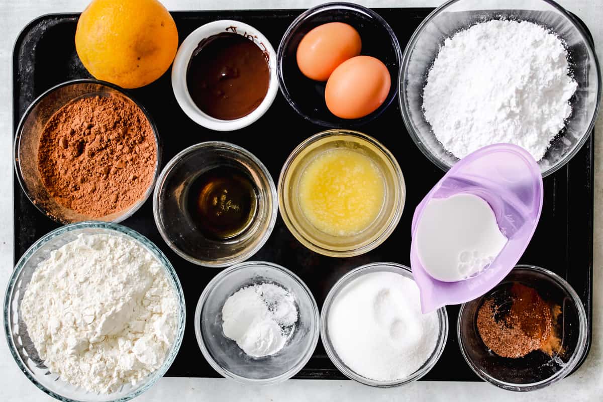 overhead image of ingredients to make chocolate spice cookies on a baking sheet.