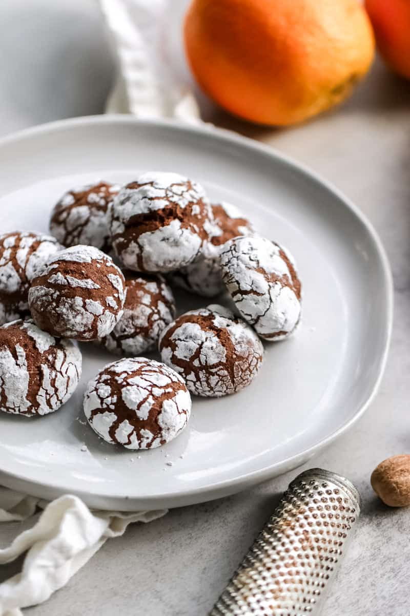 close-up image of chocolate spice cookies on a white plate.