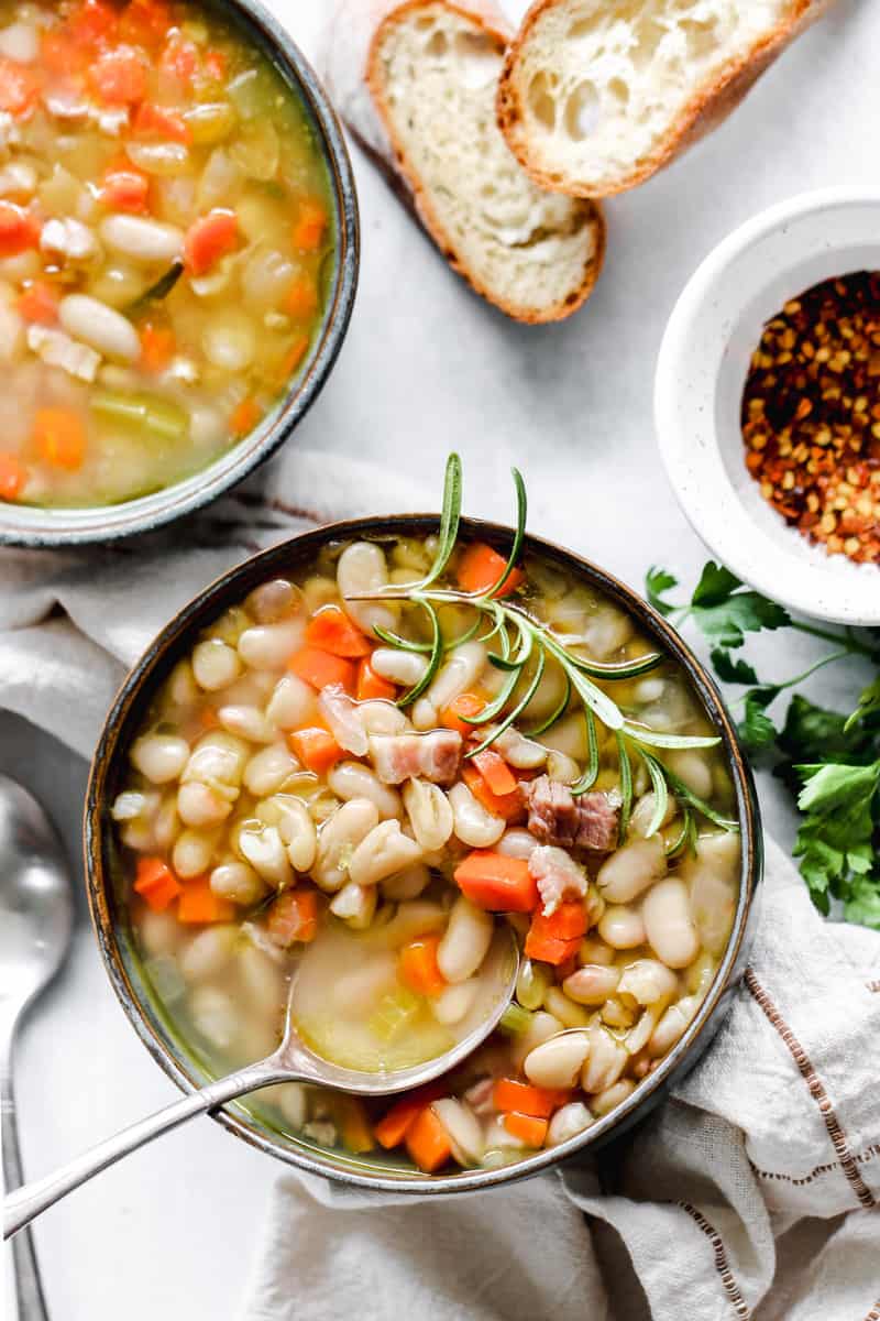 Tuscan white bean soup in a grey bowl.