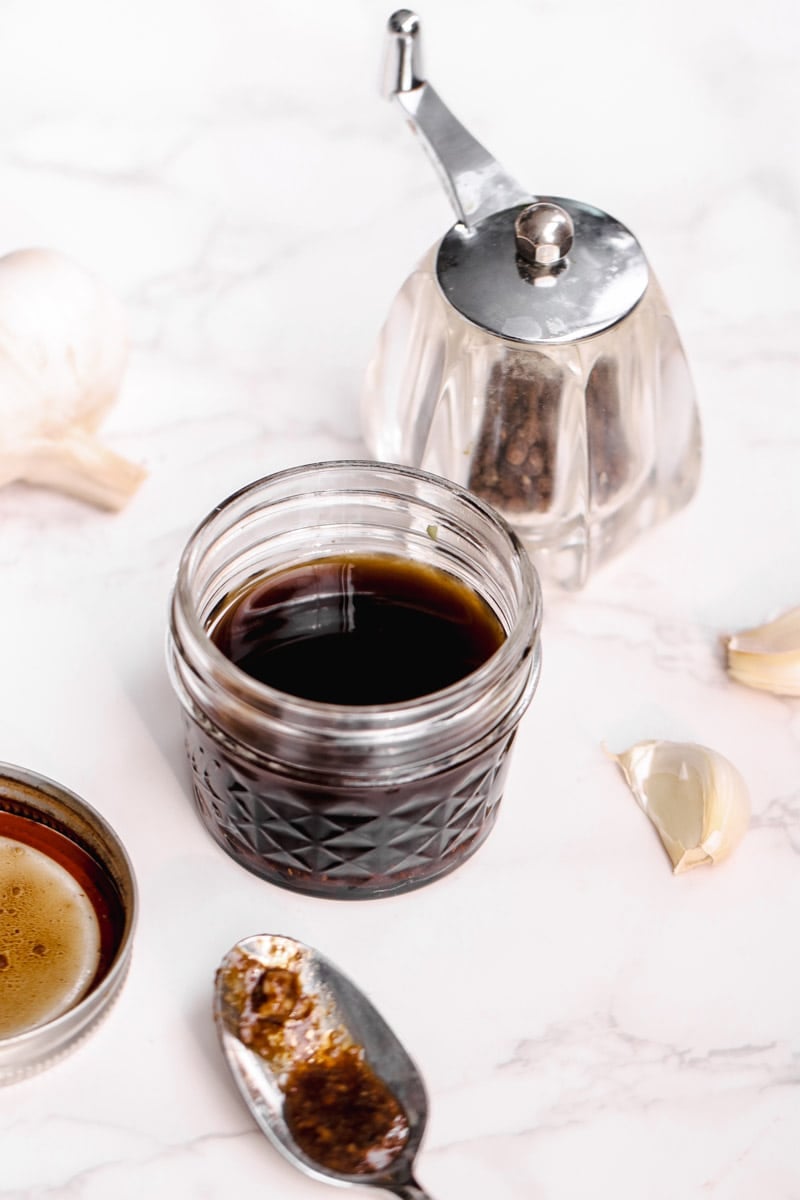 close up image of Italian dressing and a spoon.