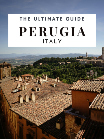 A captivating main cover image for a travel guide about Perugia, Italy, featuring an elevated view of the city's historic center. The scene highlights Perugia's medieval charm with its terracotta rooftops, ancient towers, and beautiful stone buildings. Narrow cobblestone streets wind through the city, lined with colorful flower boxes and rustic lanterns. In the foreground, the grand facade of the Perugia Cathedral stands proudly, while the lush green Umbrian hills provide a breathtaking backdrop. The vibrant and picturesque atmosphere invites readers to explore and experience the rich cultural heritage and scenic beauty of Perugia.
