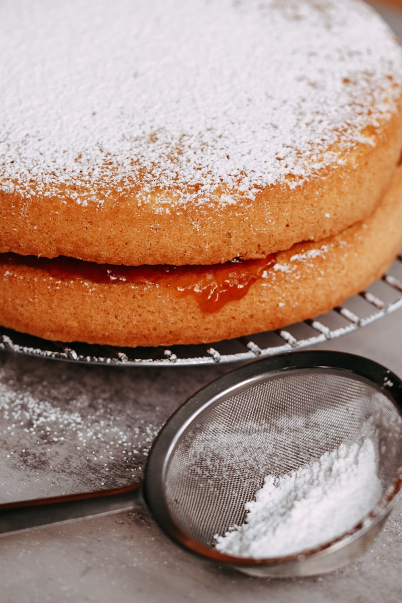 close up image of a slice of pan di spagna cake.