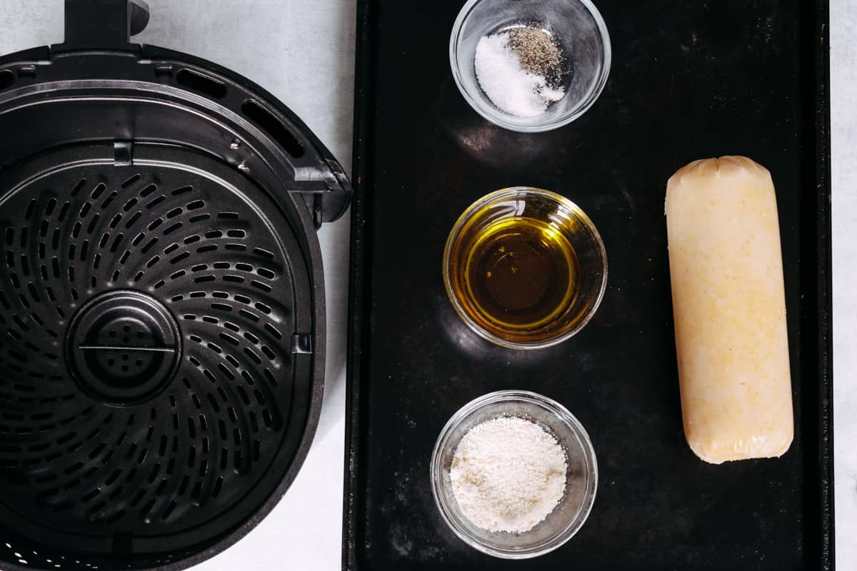 overhead image of an air-fryer and ingredients to make polenta slices.