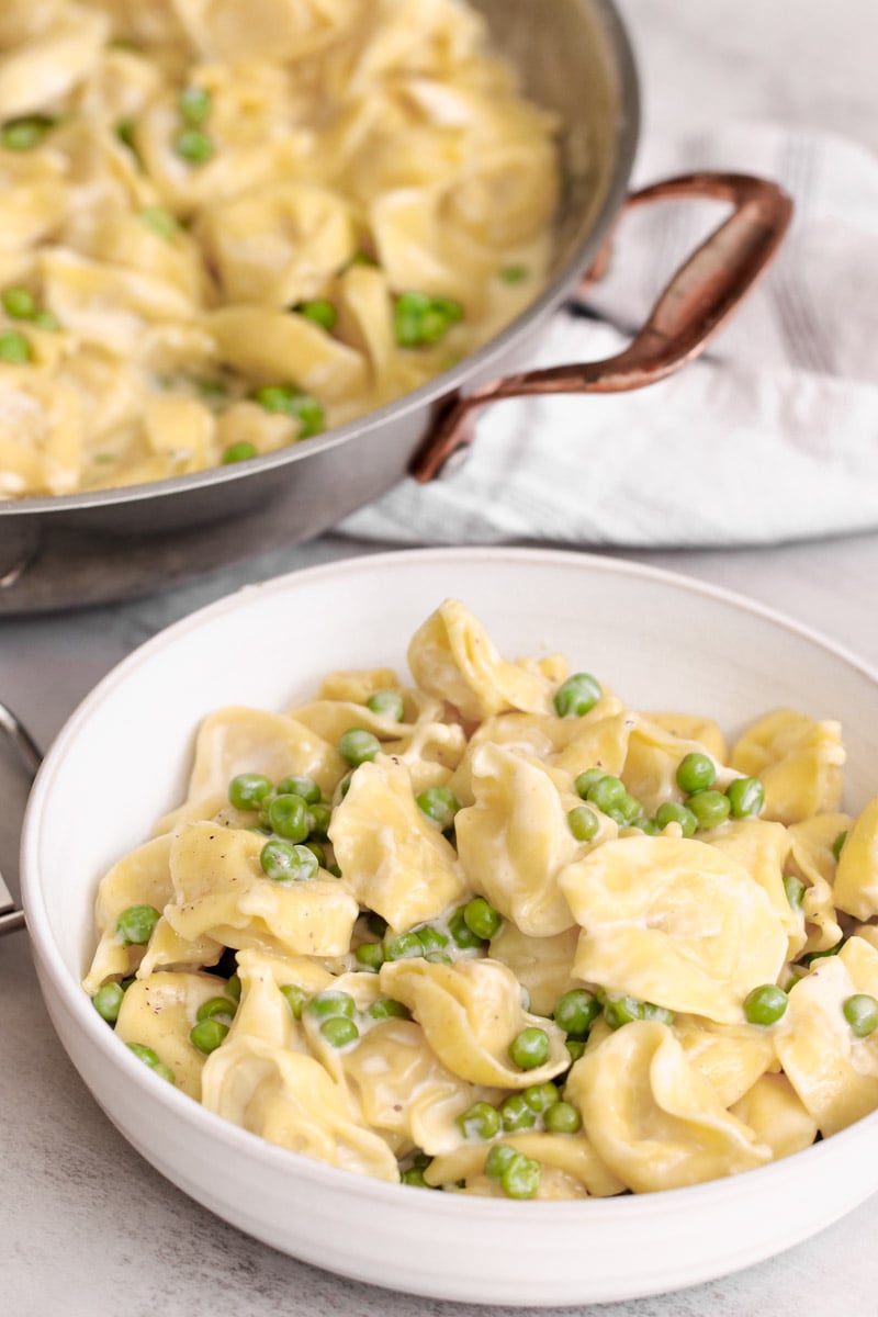 close up image of tortellini alla panna in a bowl.