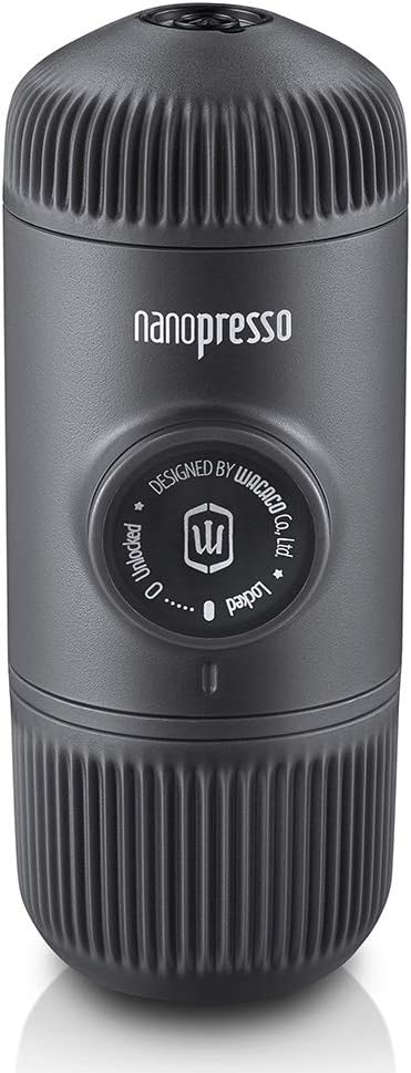 A high-resolution photograph of the WACACO Nanopresso Portable Espresso Maker set against a clean white background. This innovative and compact espresso maker features a sleek, cylindrical design with a matte black finish and ergonomic, ribbed grips for secure handling. The WACACO logo is subtly imprinted on the side. Known for its easy manual operation and powerful pressure system, the Nanopresso can brew rich, high-quality espresso with a thick crema. Ideal for use with traveling coffee makers, the Nanopresso ensures you can enjoy a superior espresso experience wherever you are. Perfect for coffee aficionados who value portability, convenience, and excellent taste.
